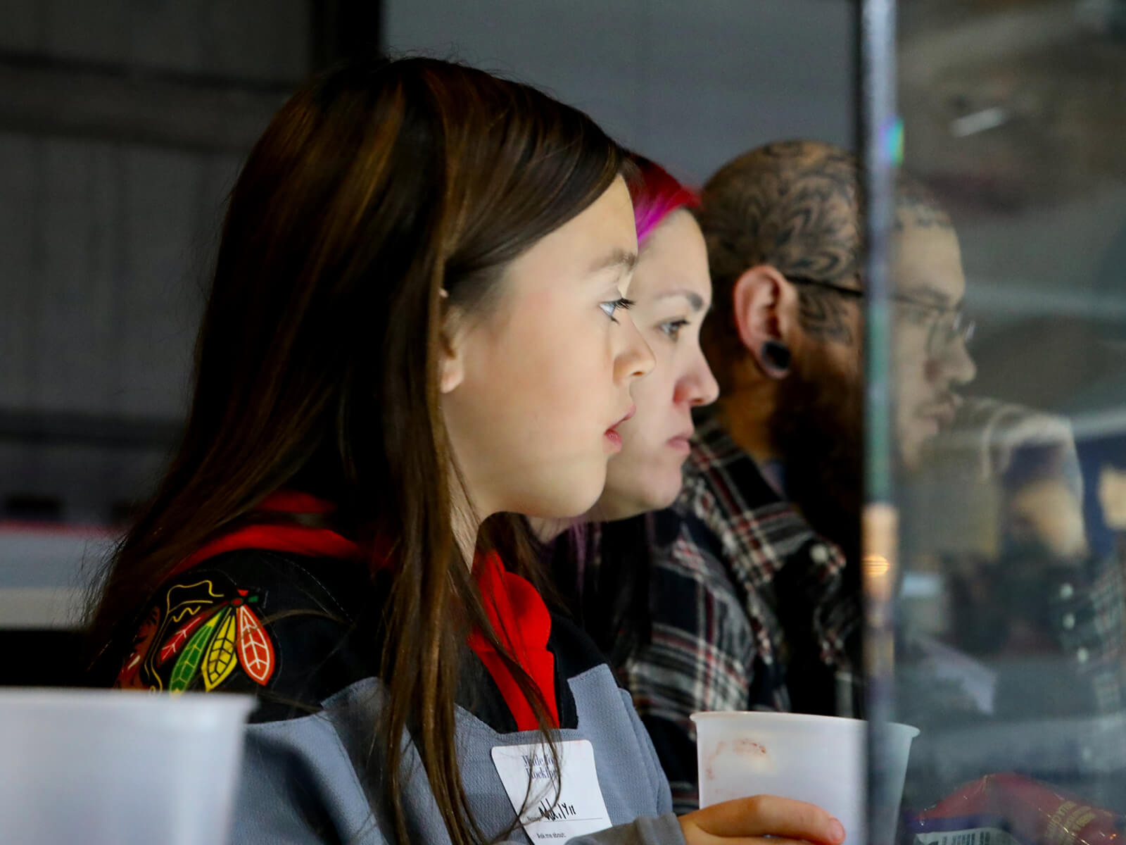 A family watching a Rockford IceHogs game at the BMO Center