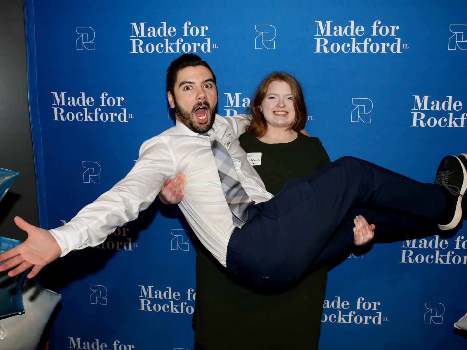 A woman holding a man at a Made for Rockford mixer