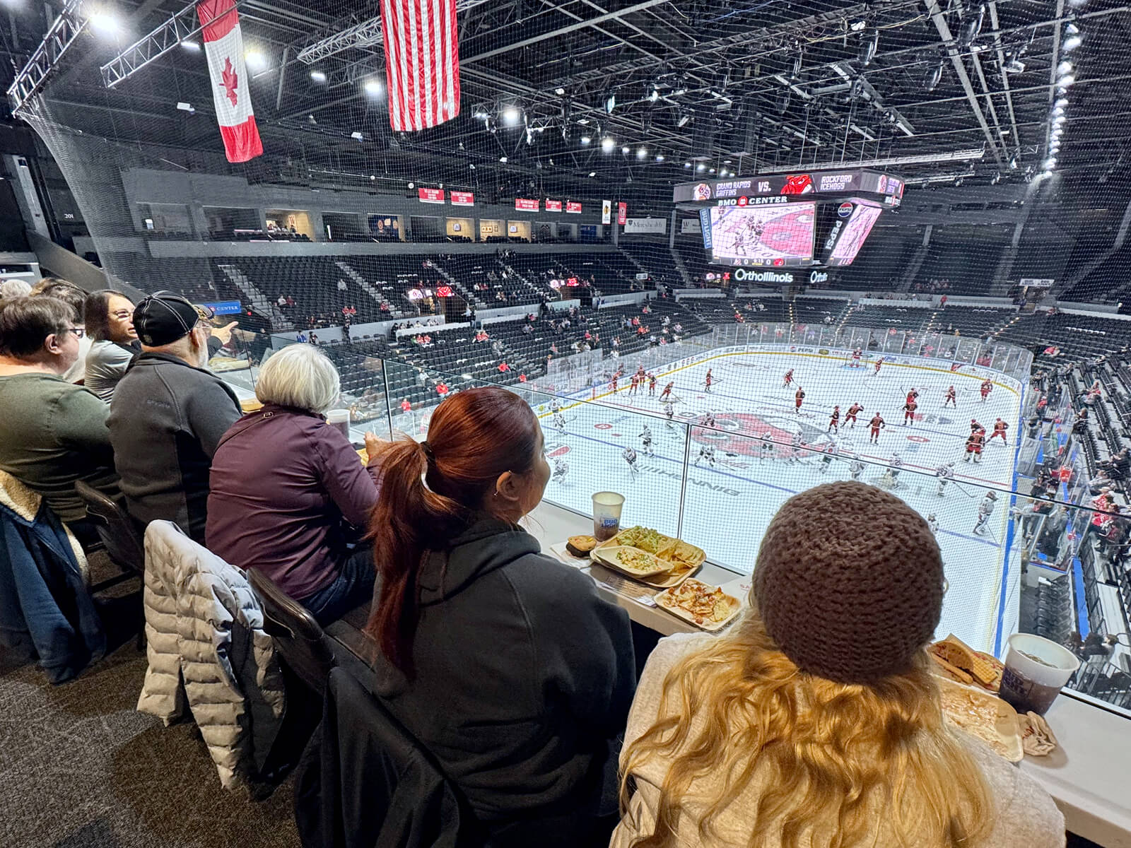 People watching the Rockford IceHogs game from the BMO Center Rooftop Suite 