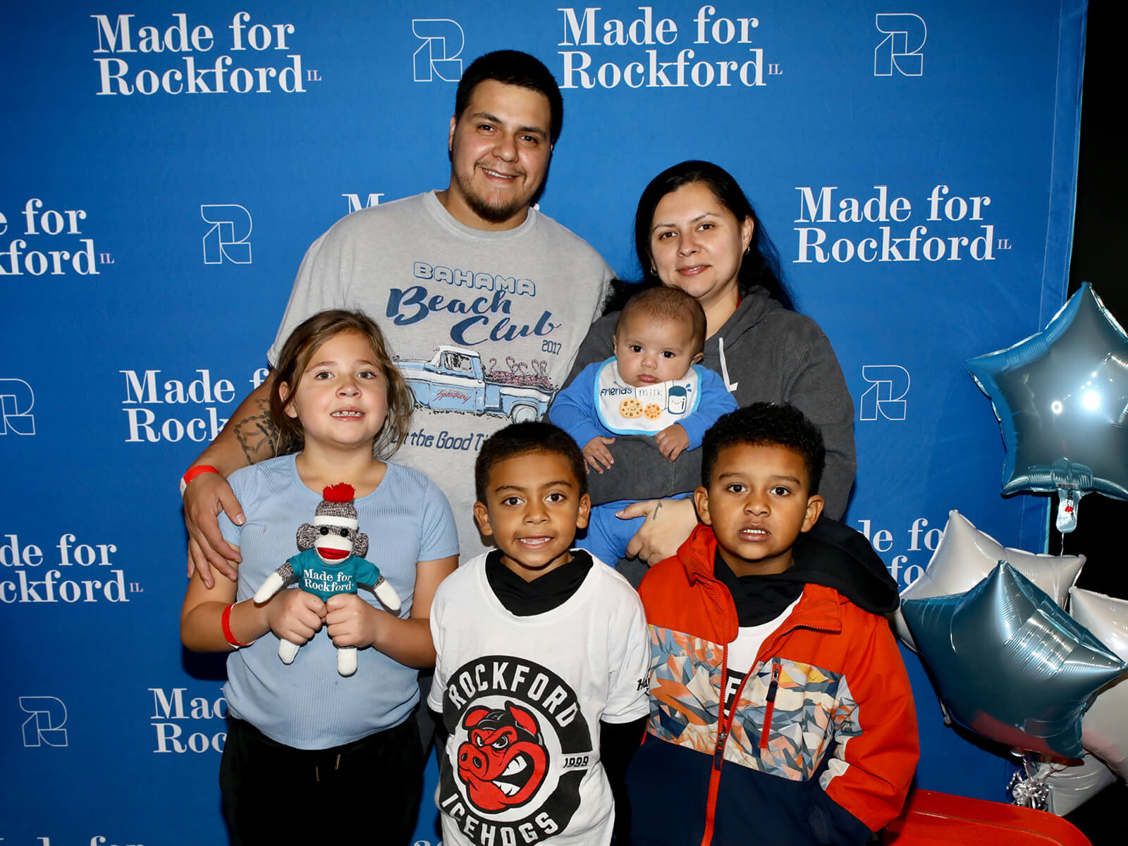 A family at a Made for Rockford mixer
