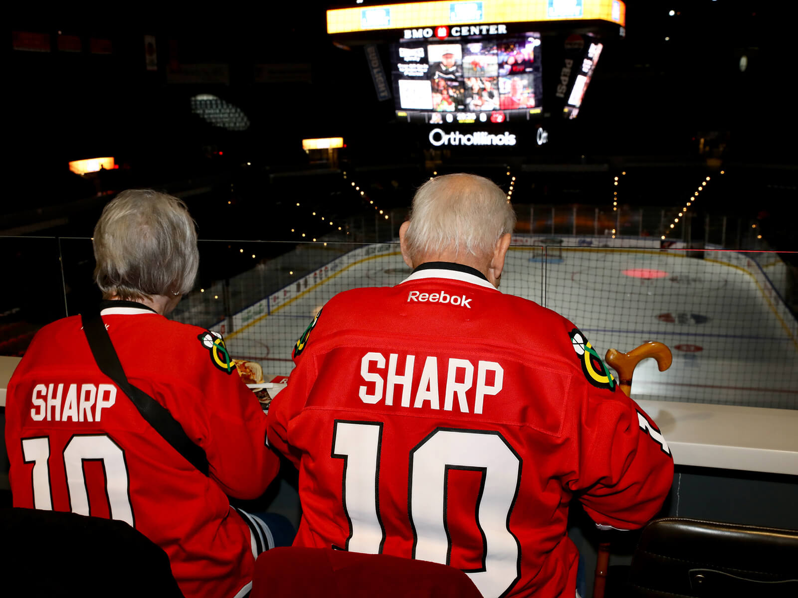 A couple sitting at the BMO Center Rooftop Suite Fall 2025 Mixer