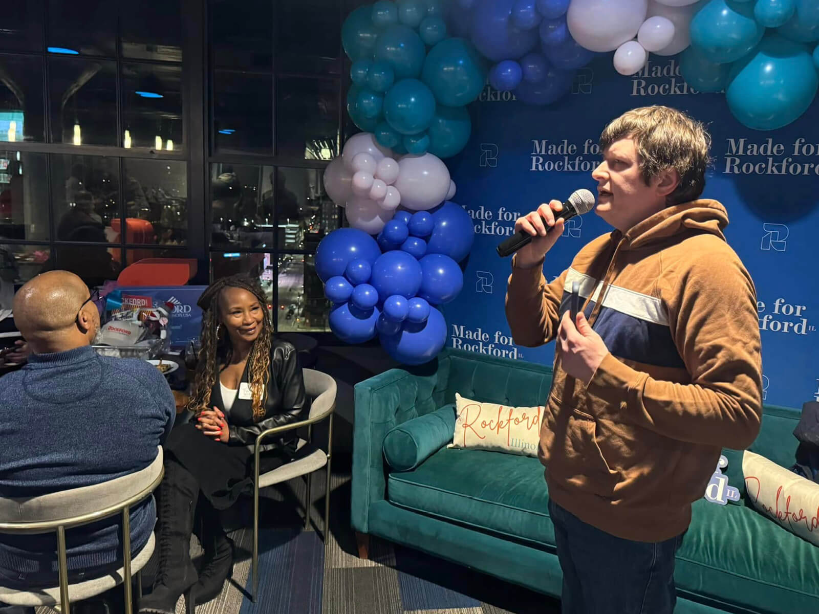 A man speaking to Rockford residents at the Made for Rockford Downtown Embassy Suites Winter 2025 Mixer