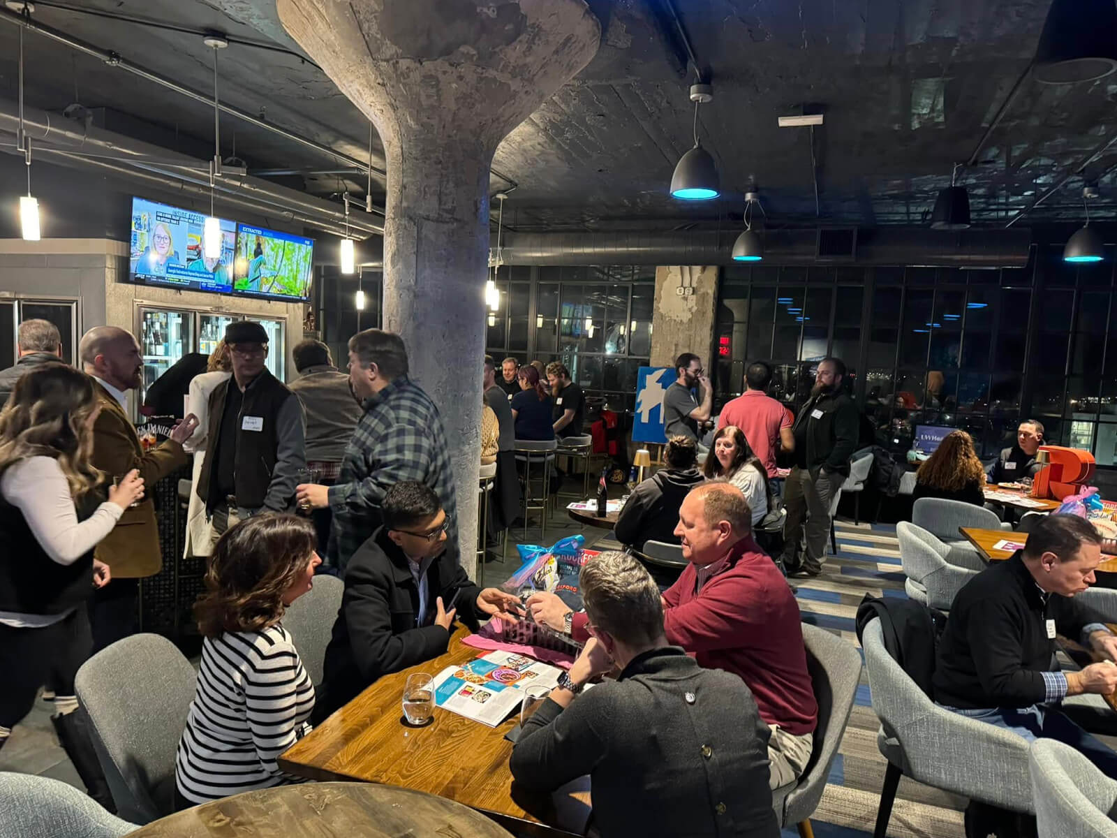 Rockford residents gathering in the Embassy Suites bar for a Made for Rockford mixer