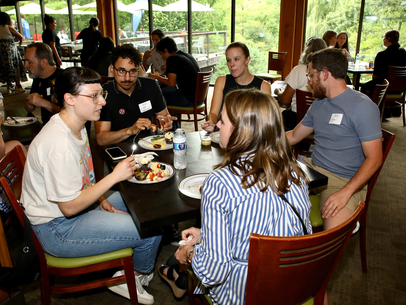 Attendees of the Made for Rockford new resident mixer eating at Anderson Japanese Gardens