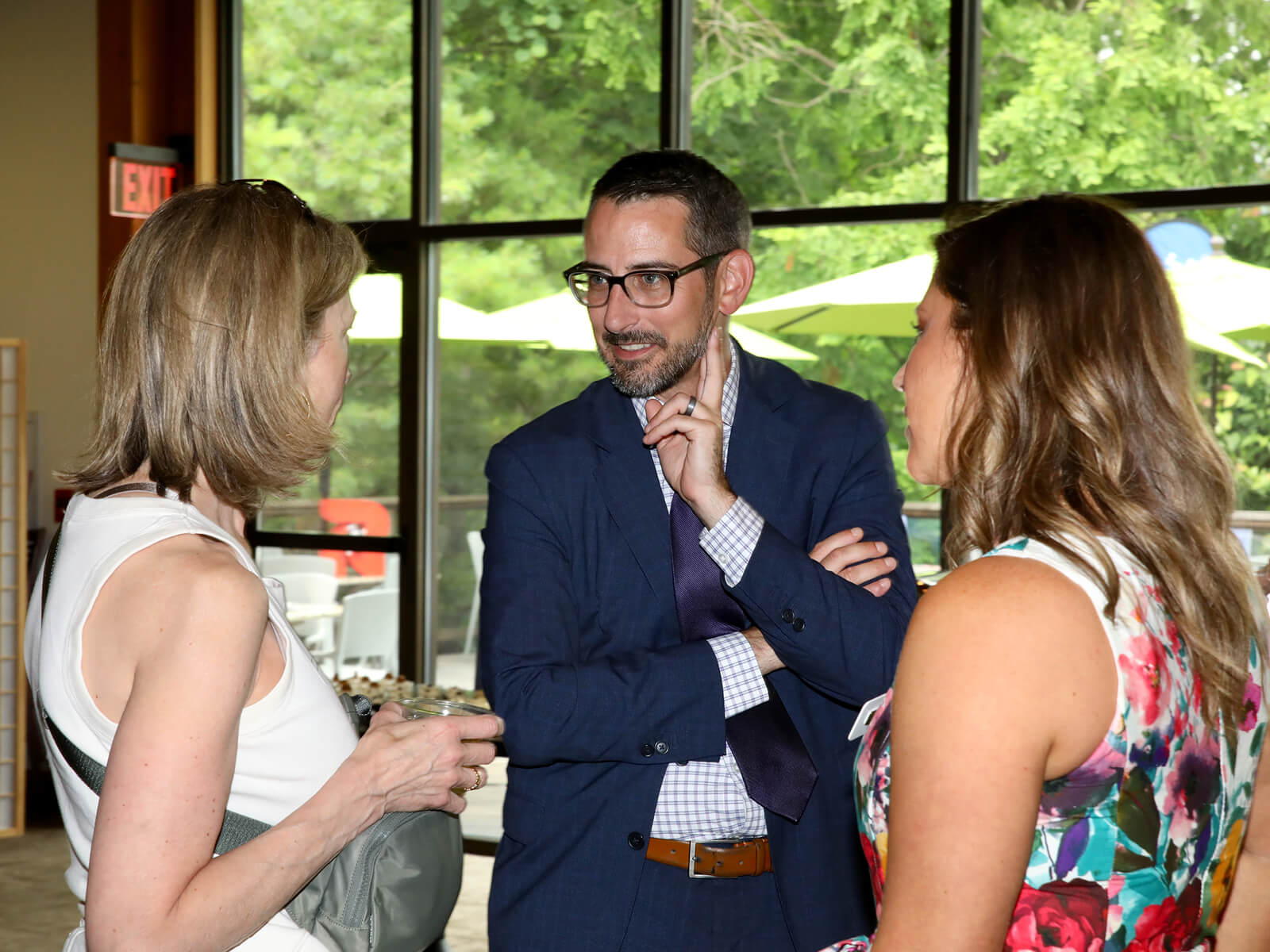 Rockford Mayor Tom McNamara talking to Rockford residents at a Made For Rockford new resident mixer