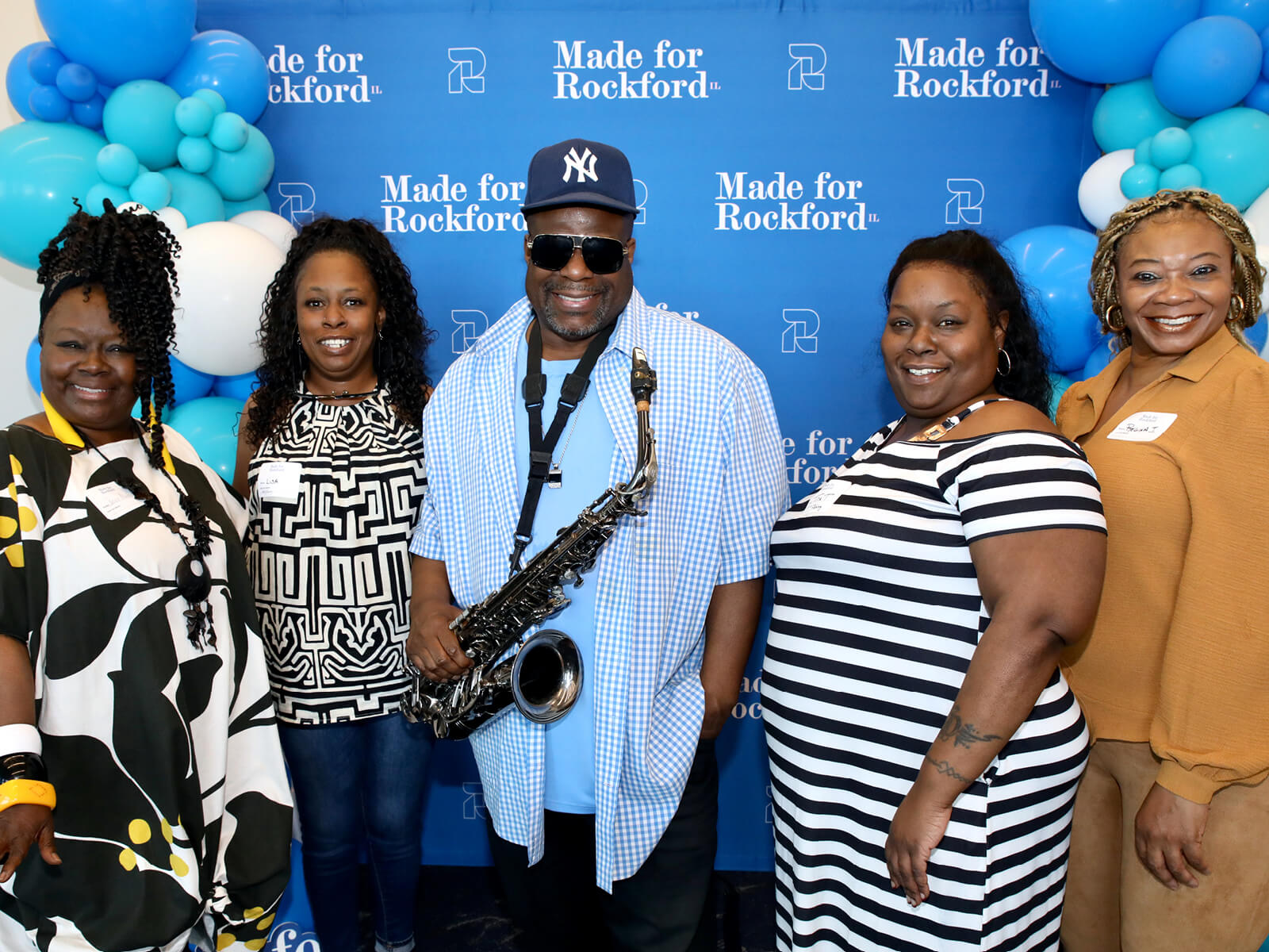 Rockford residents posing at a new resident mixer