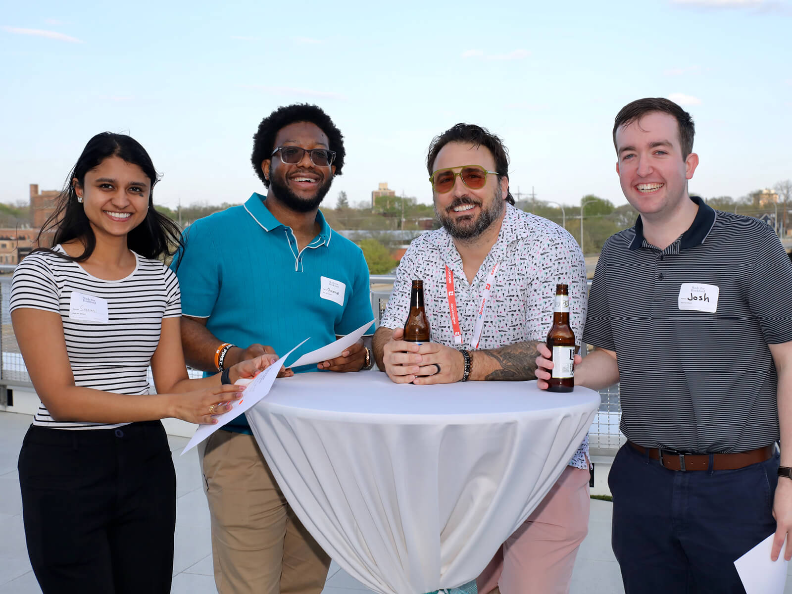 Rockford residents mingling at a table at a new resident mixer