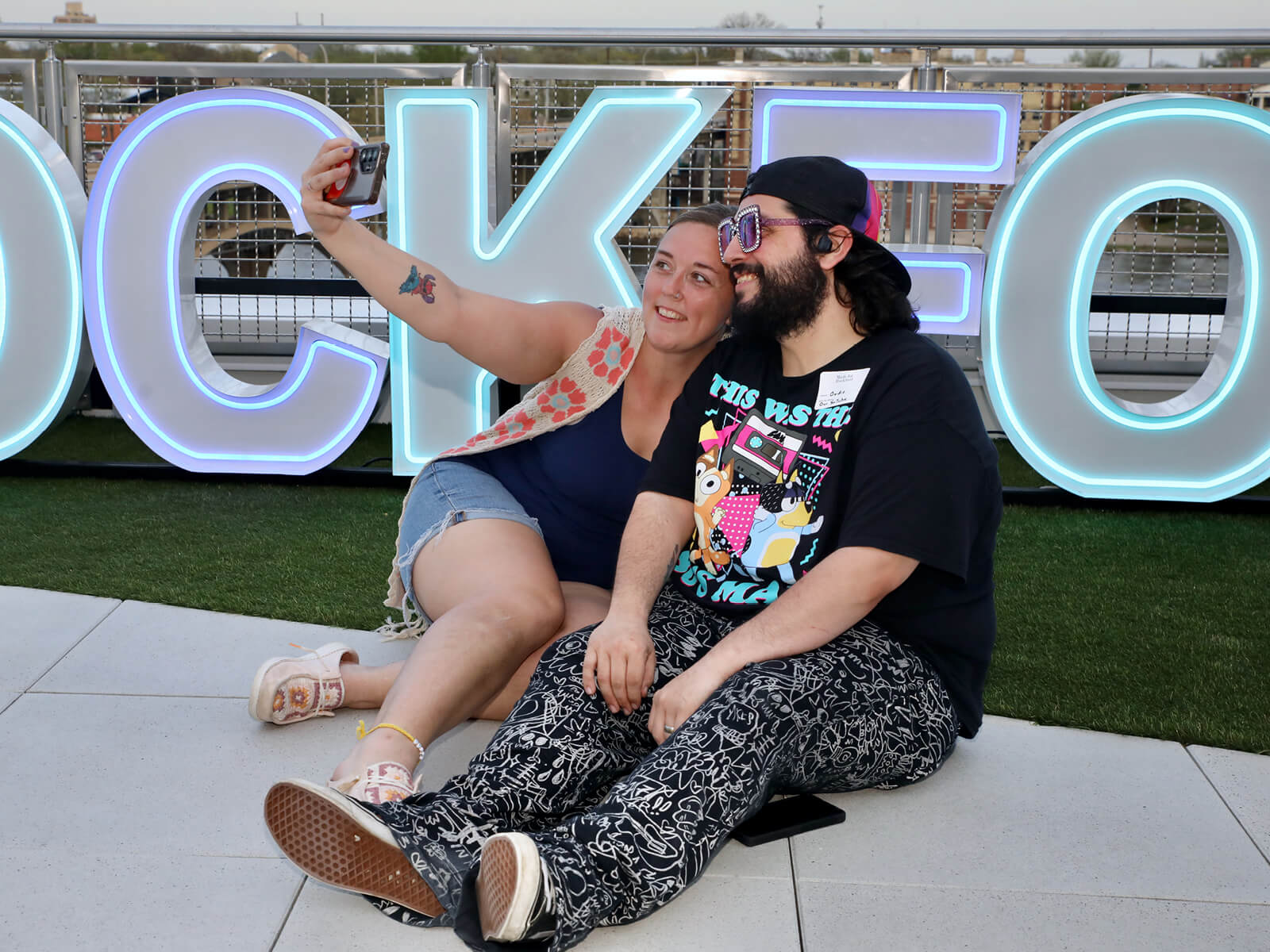 A couple takes a selfie at a Rockford new resident mixer
