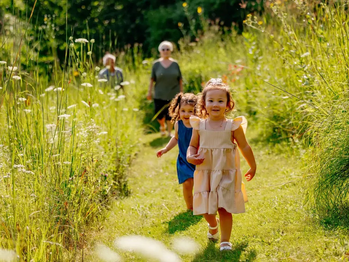 Children running through Klehm Arboretum