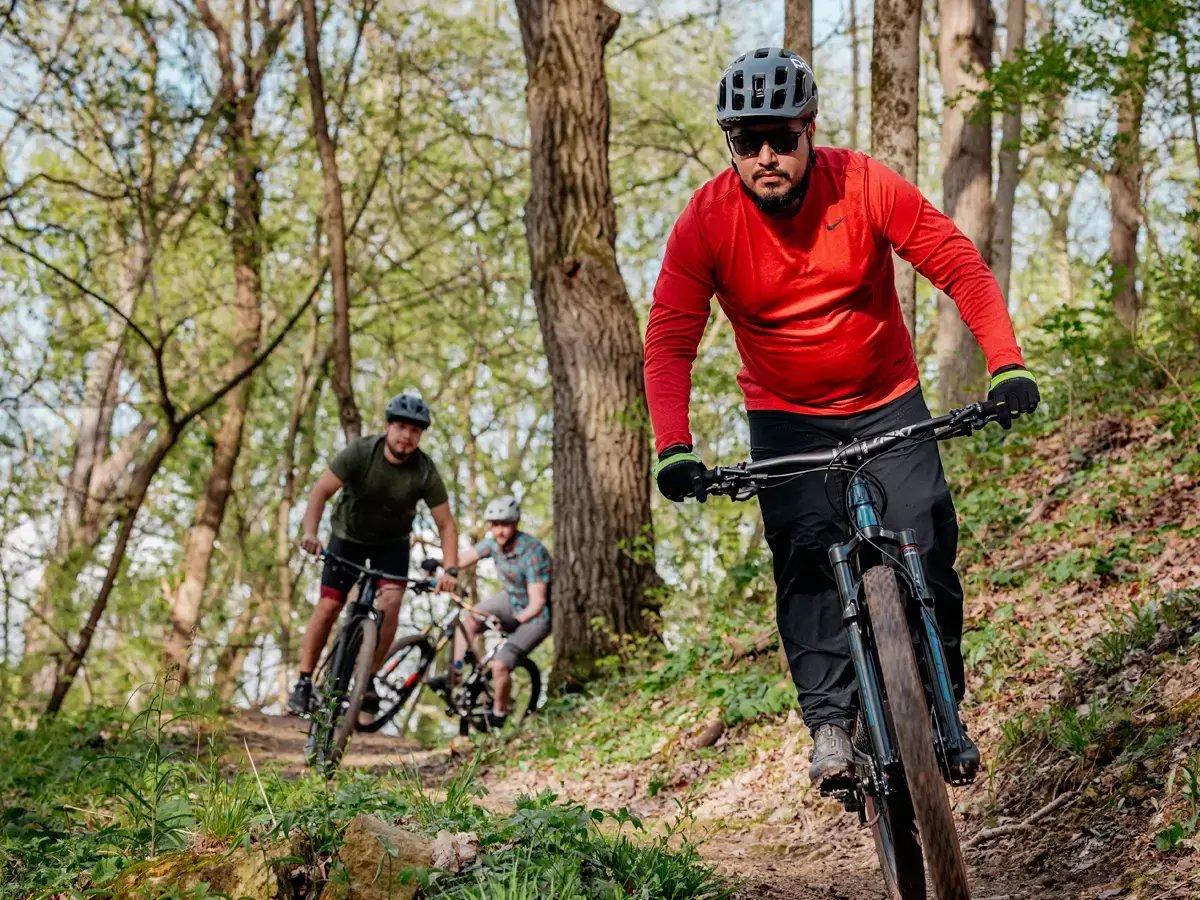Bikers biking through trail